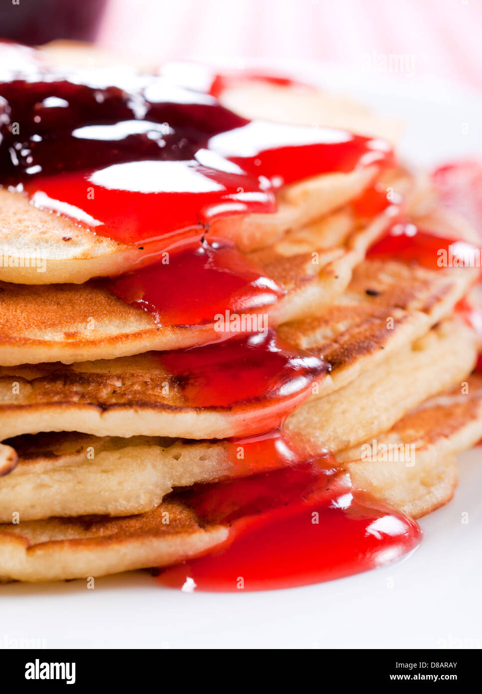 Traditional American homemade pancakes with strawberries toping Stock Photo