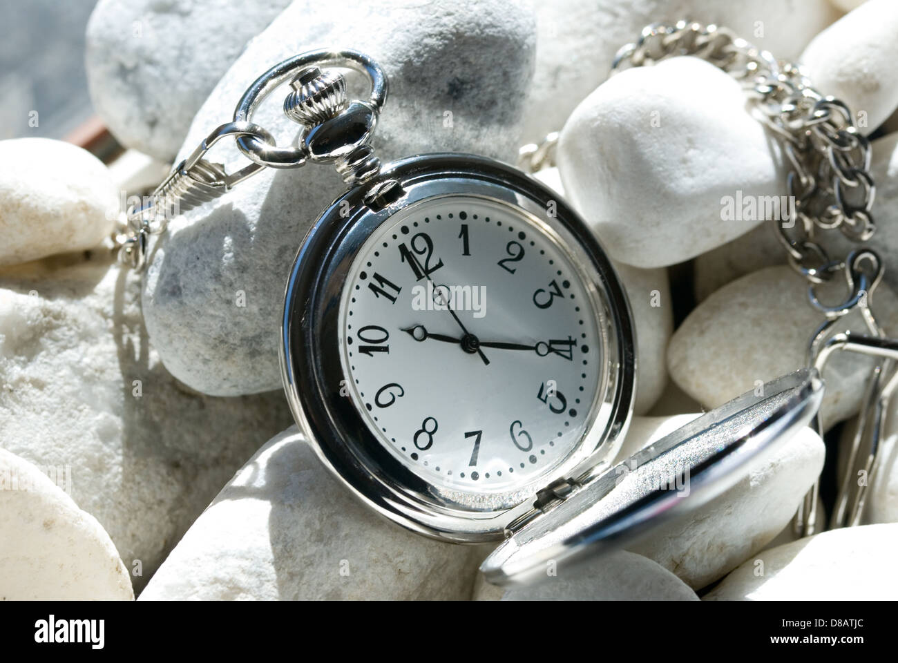 close up of old vintage pocket watch on stones. Stock Photo
