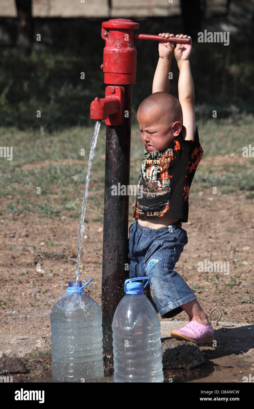 Indian boy carrying water bottle hi-res stock photography and images - Alamy