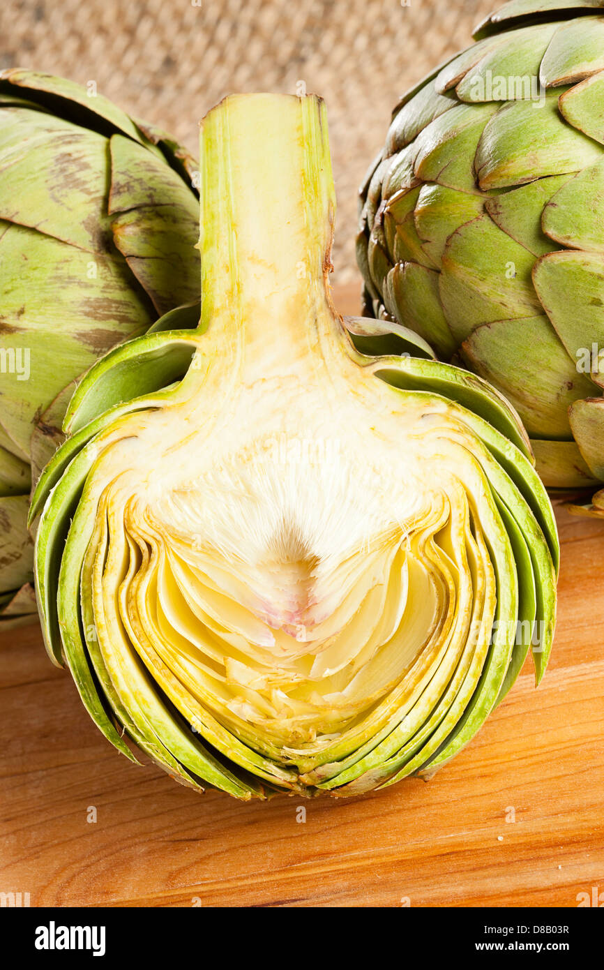 Fresh Green Organic Artichoke against a background Stock Photo