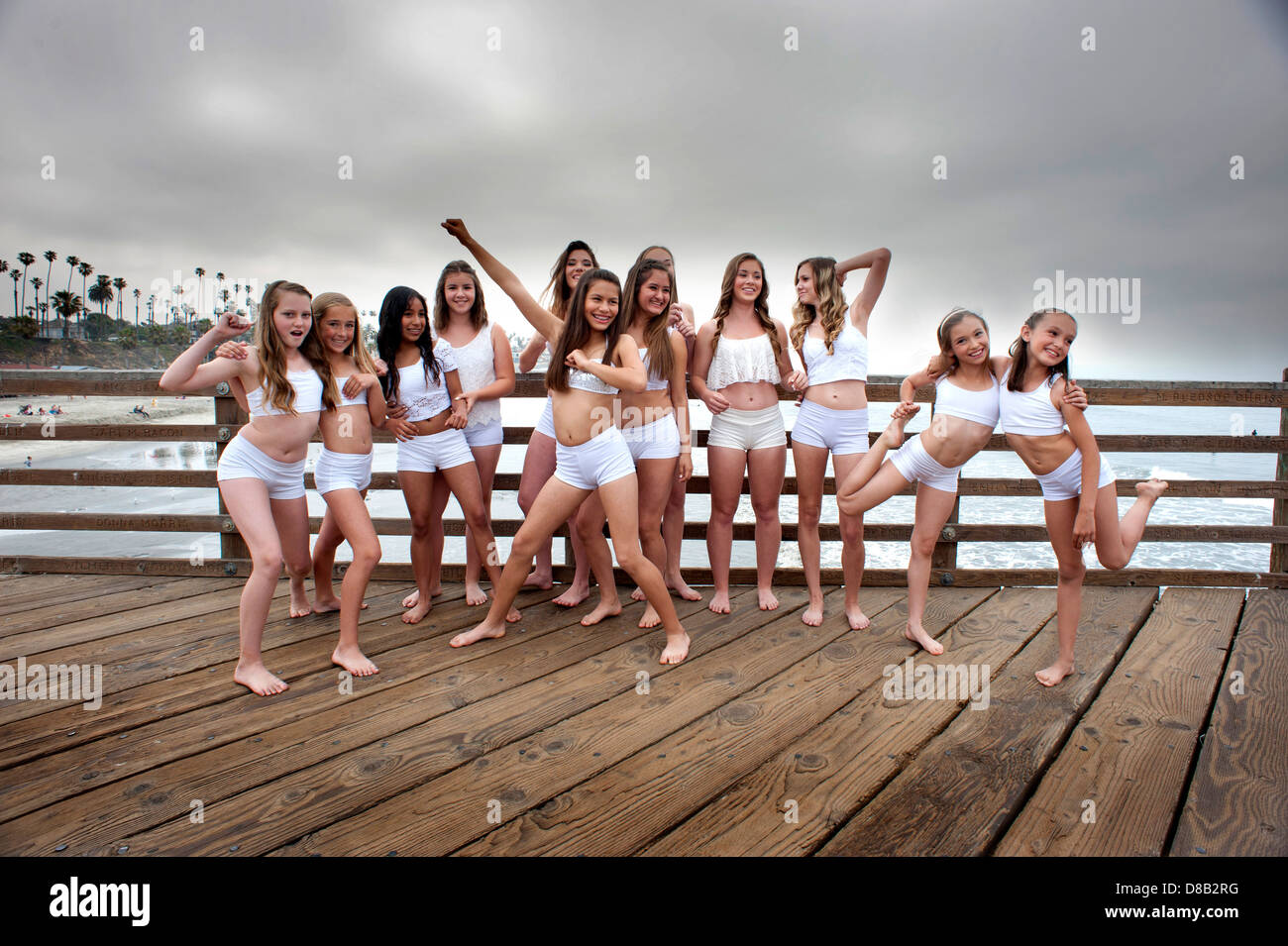 Girls gymnastic group on the pier at Oceanside, California. Stock Photo