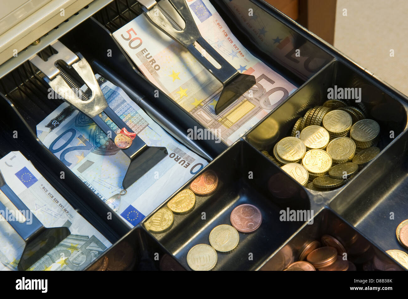 Cash money in drawer at a paydesk in a store Stock Photo