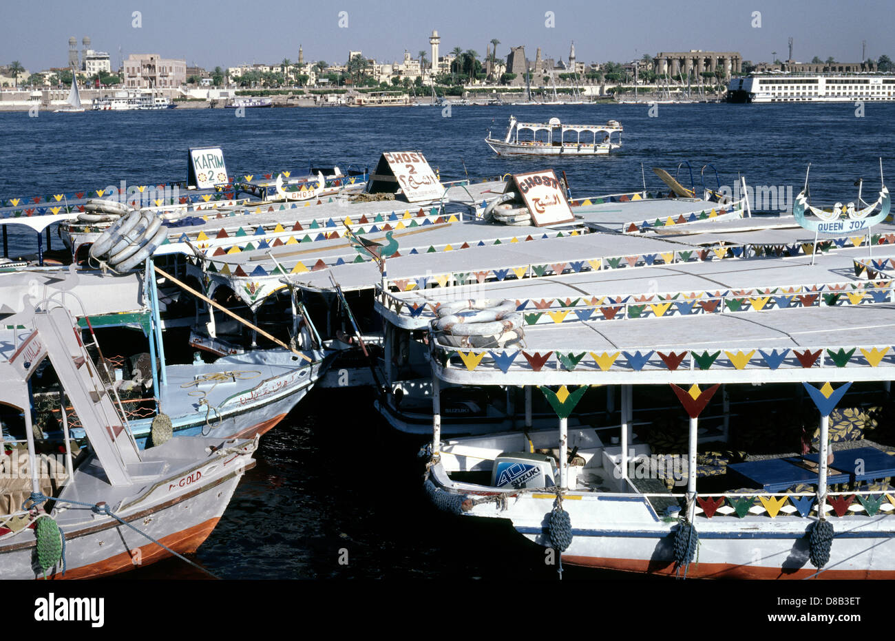 Sightseeing boats moored on Luxor's West Bank in Egypt. Stock Photo