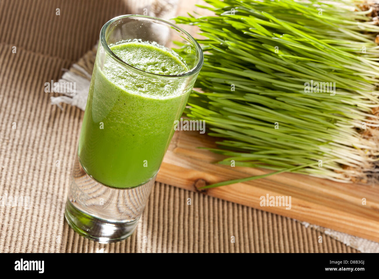 Green Organic Wheat Grass Shot ready to drink Stock Photo Alamy