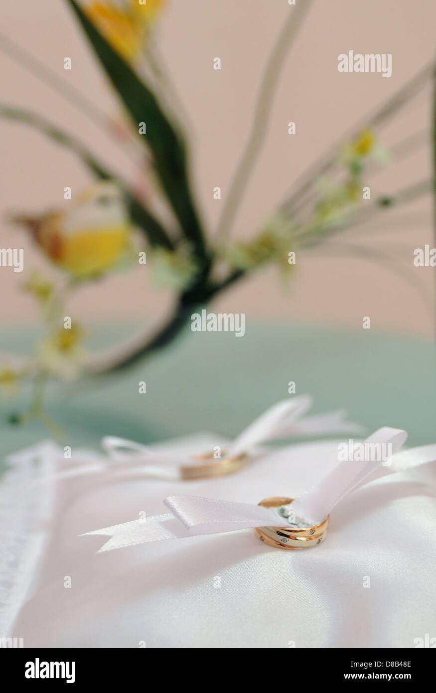 gold wedding rings on a pillow in the registry office Stock Photo Alamy