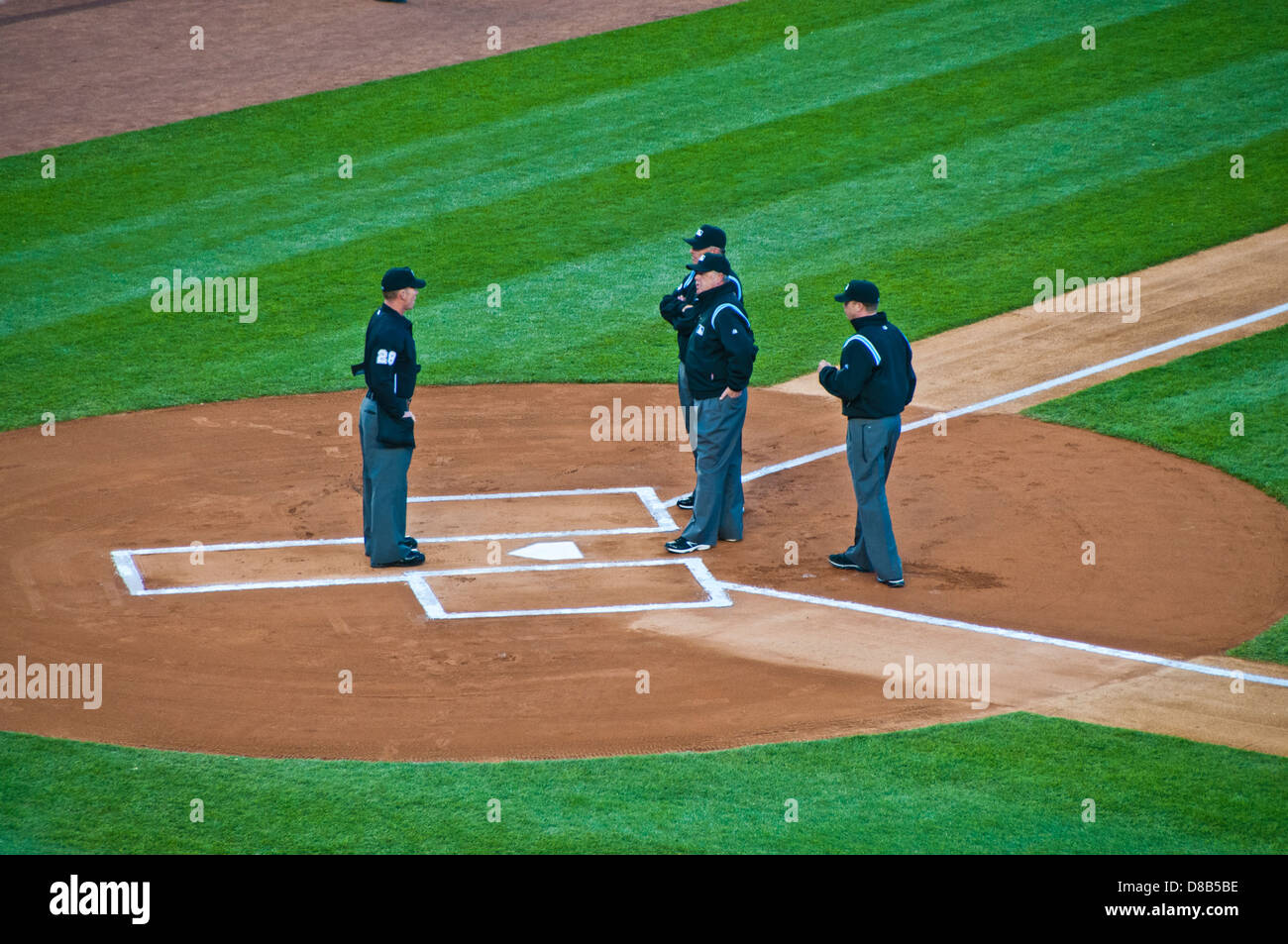 umpires meeting baseball field Stock Photo