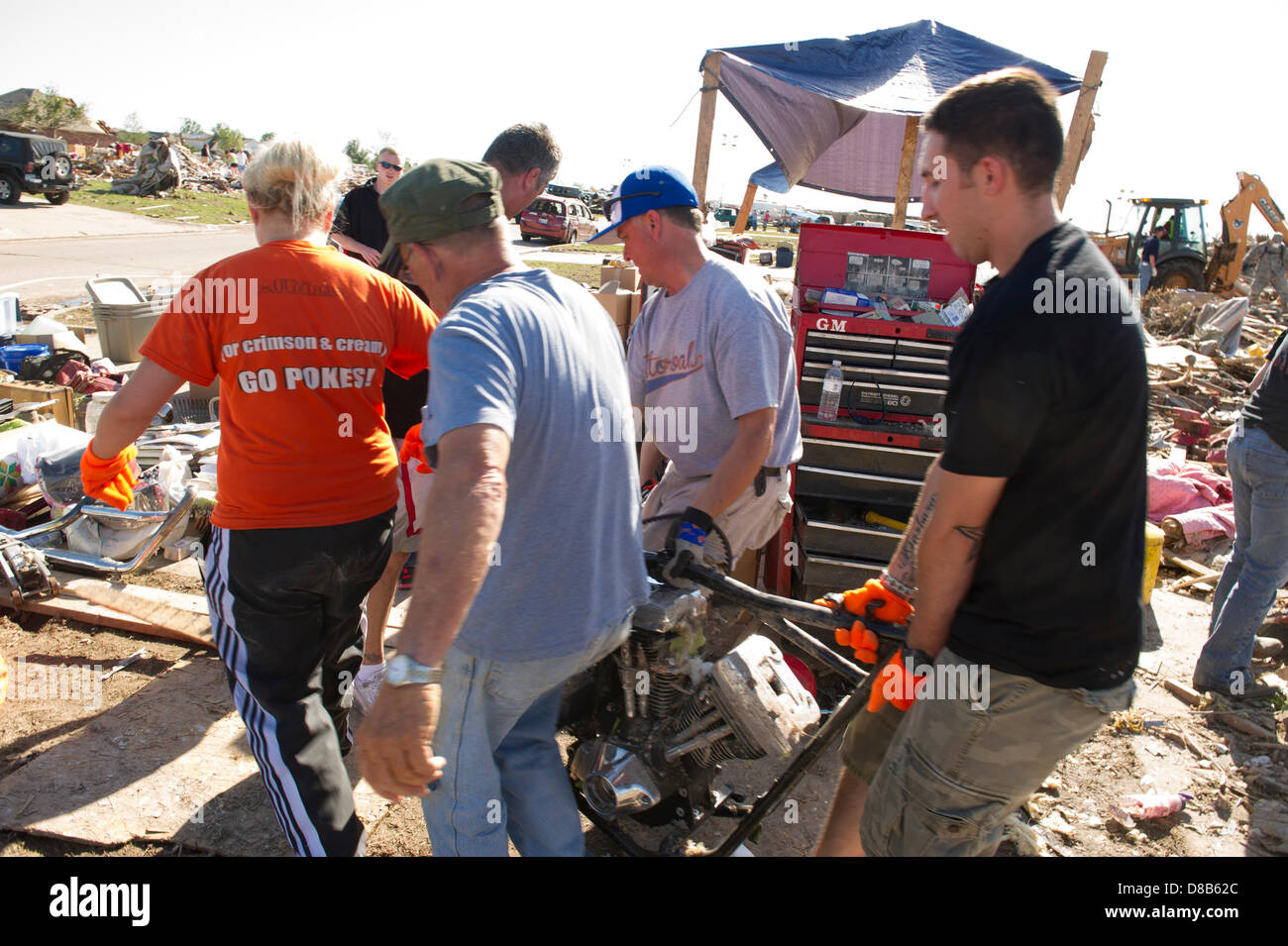 May 22 2013 Moore Oklahoma. Gerald Mobley and his friends drags his