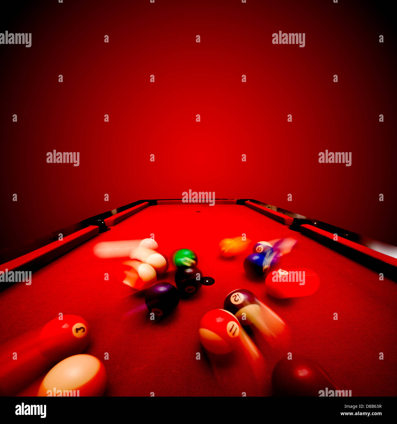 Billards pool game. Breaking the color ball from triangle. Red cloth table Stock Photo