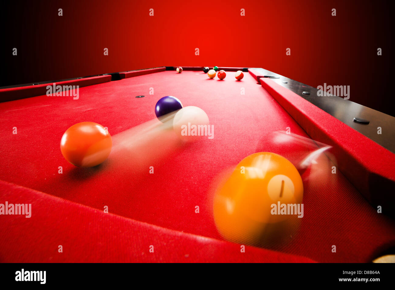 Billards pool game. Breaking the color ball from triangle. Red cloth table Stock Photo