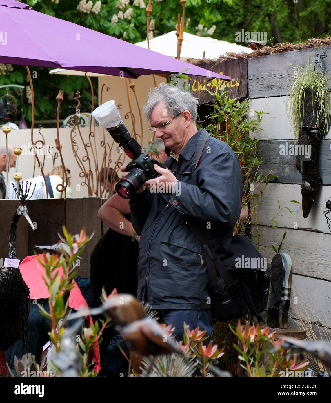 Martin Parr the photographer at work at the Chelea Flower show Stock Photo