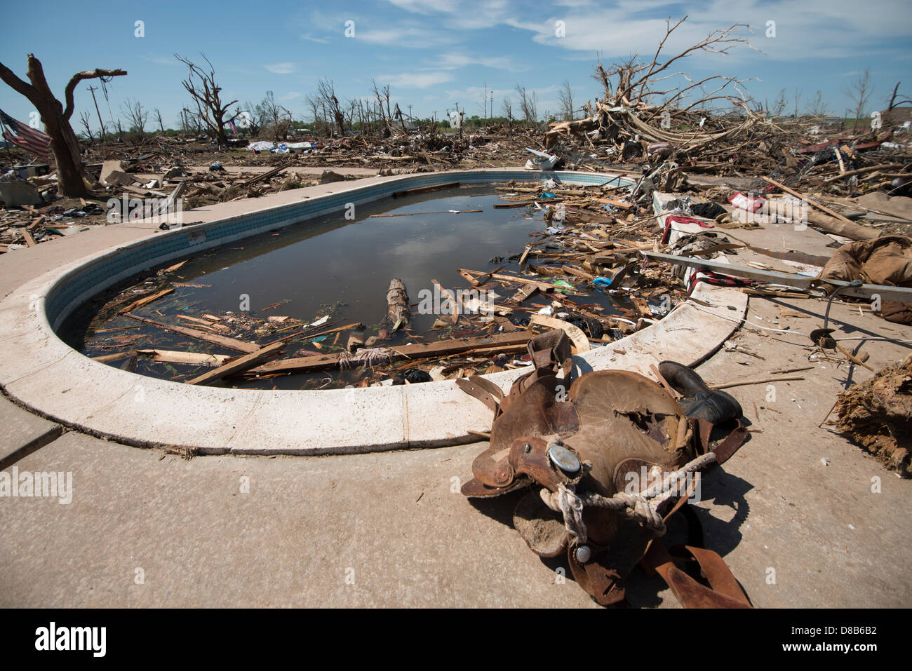 May 22 2013 Moore Oklahoma. A swimming pool is filled withe debris and