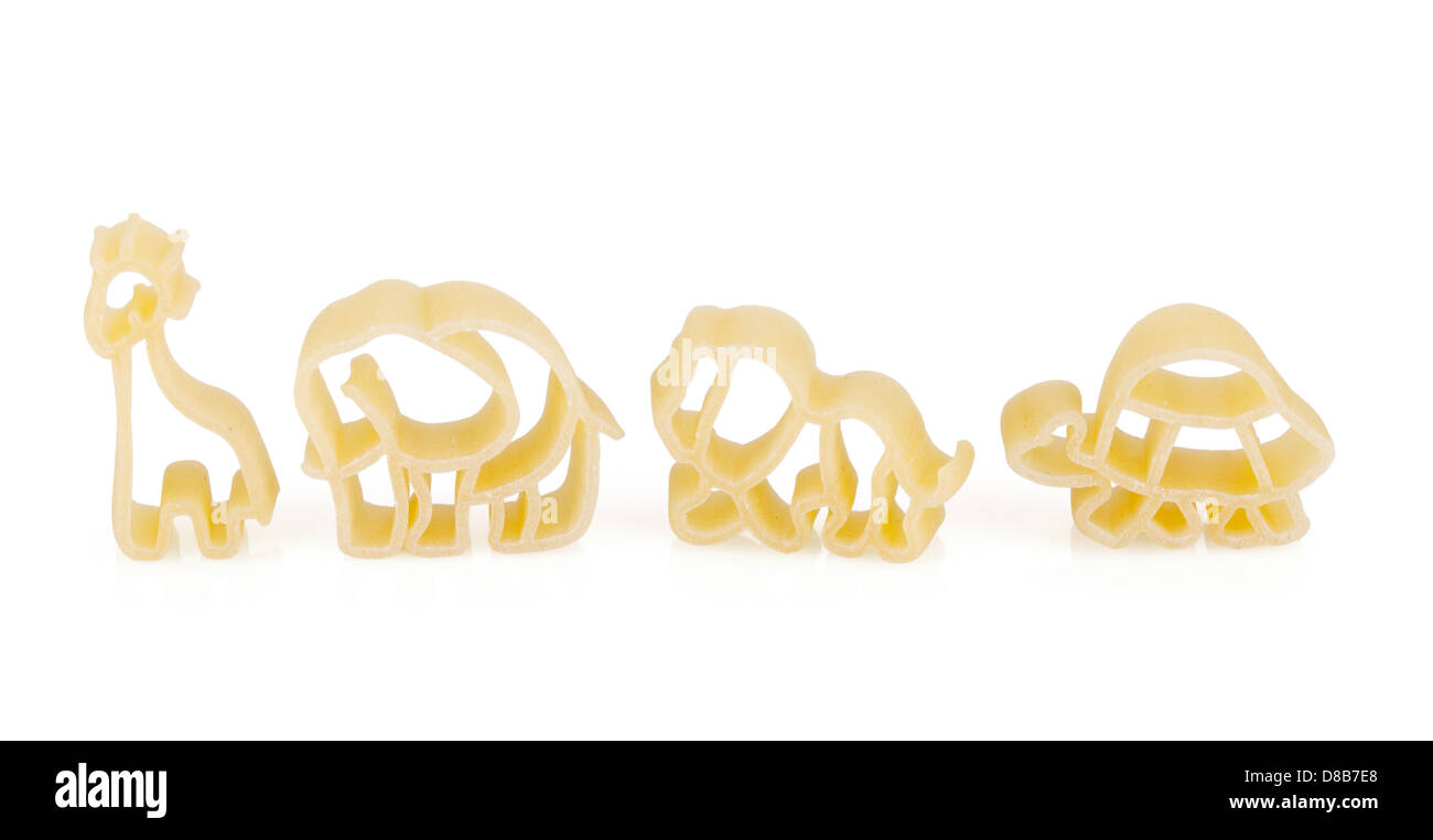 Baby pasta with animals shape: tortoise, lion, elephant, giraffe. Isolated on white background Stock Photo