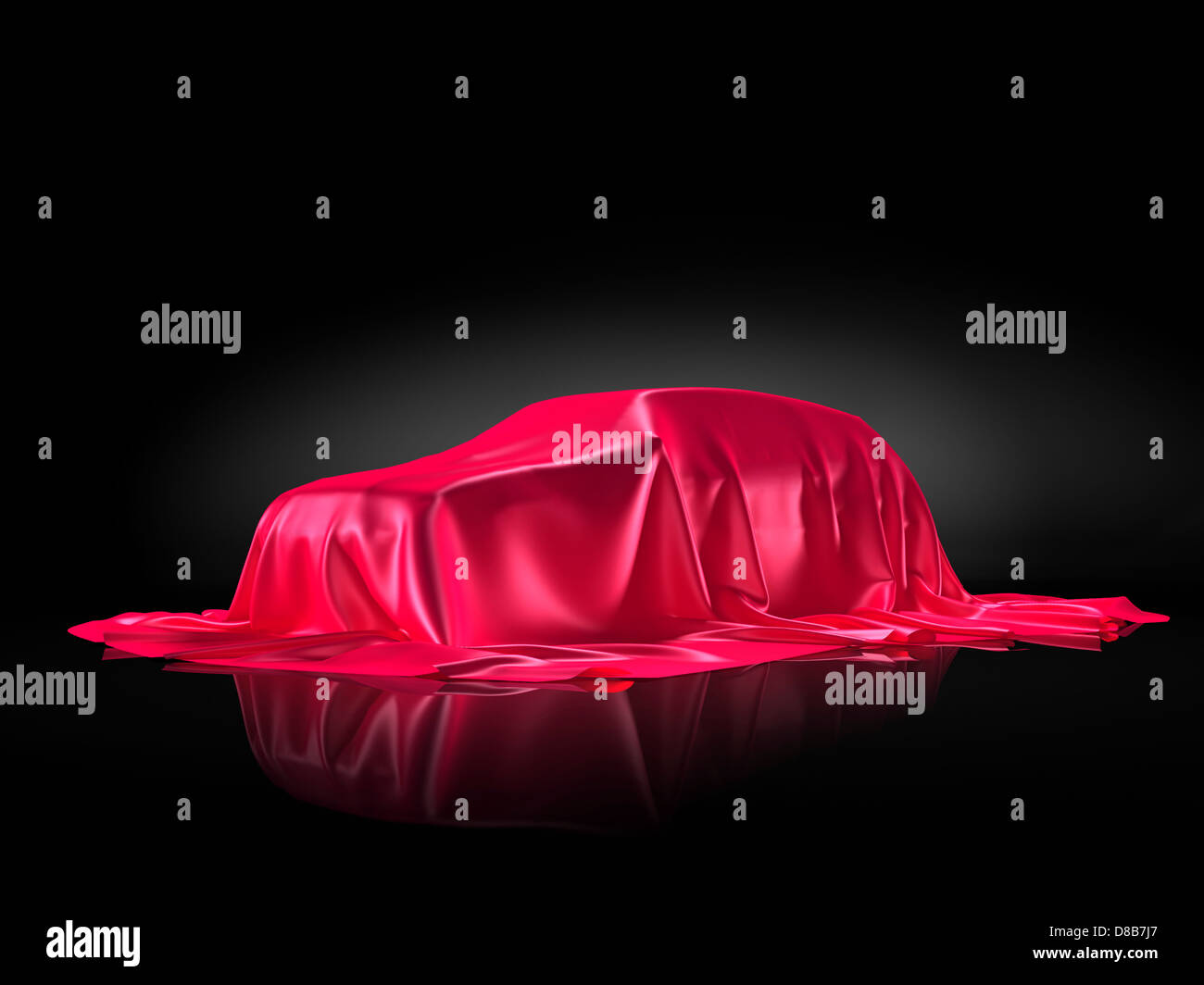 New car model on a stand under red fabric presentation concept isolated on black background Stock Photo
