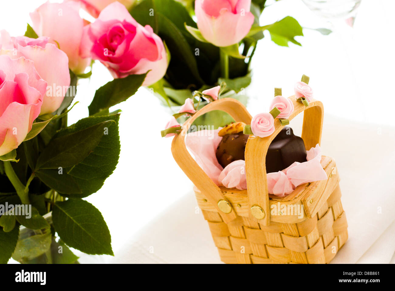 Miniature picnic baskets favor boxes filled with truffles Stock Photo