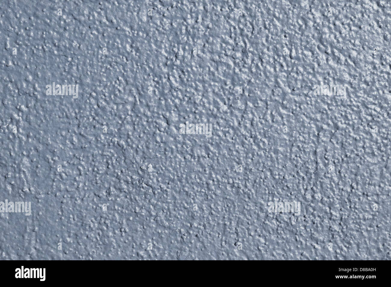 View of A textured wall painted in blue-gray, offering a cool and calming ...