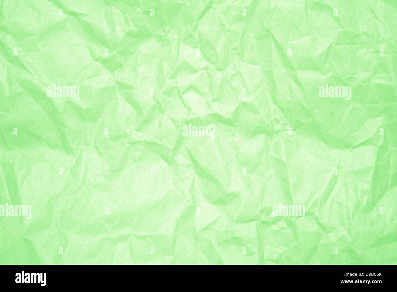 Green Ribbled Paper A crumpled light green paper with visible wrinkles and folds. The ...