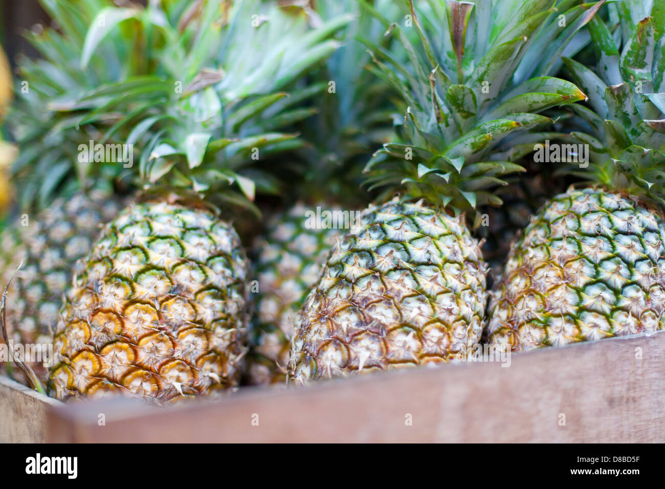 Bananas and pineapples on asian market Stock Photo Alamy