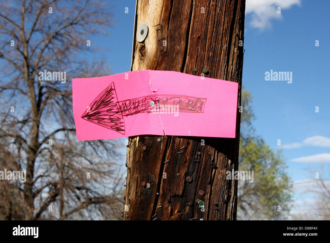 hand drawn arrow sign on telephone pole Stock Photo Alamy