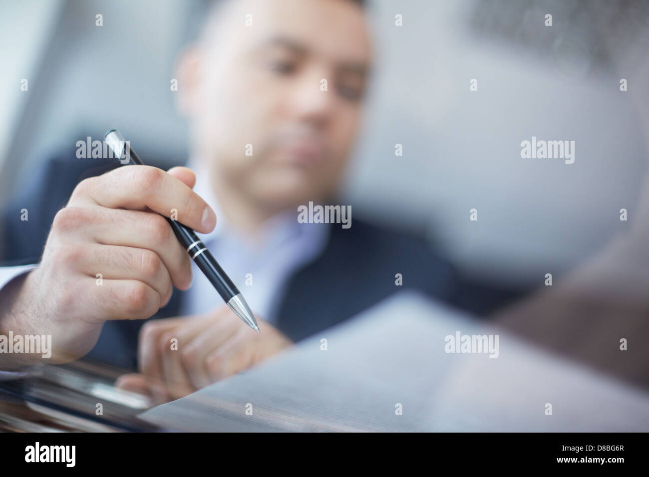 Close-up of male hand with pen Stock Photo - Alamy