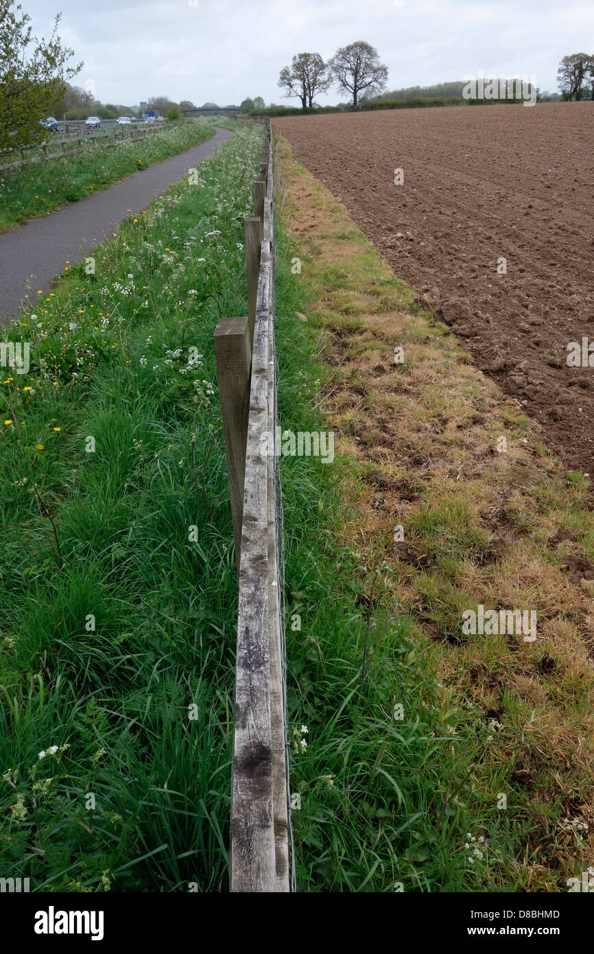 Intensive land use with fields sprayed right up to the fence with