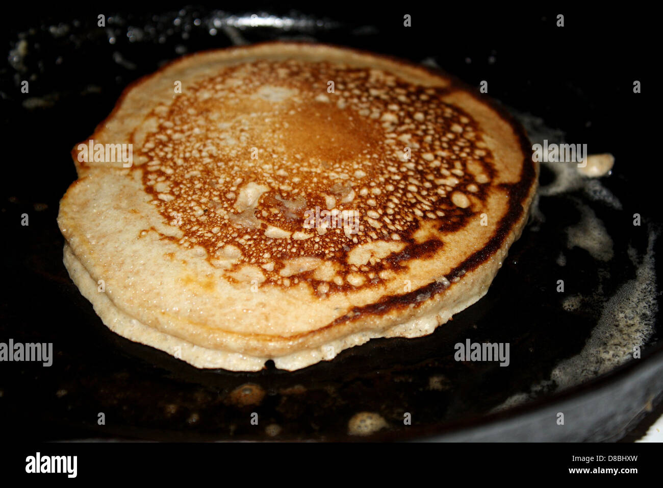 pancake cooking in cast iron frying pan Stock Photo - Alamy