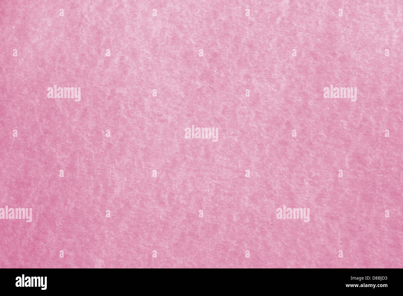 This image highlights the texture of pink parchment paper, commonly ...