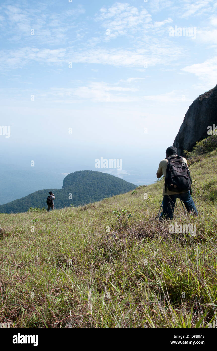Tourists taking photographs in western ghats Stock Photo