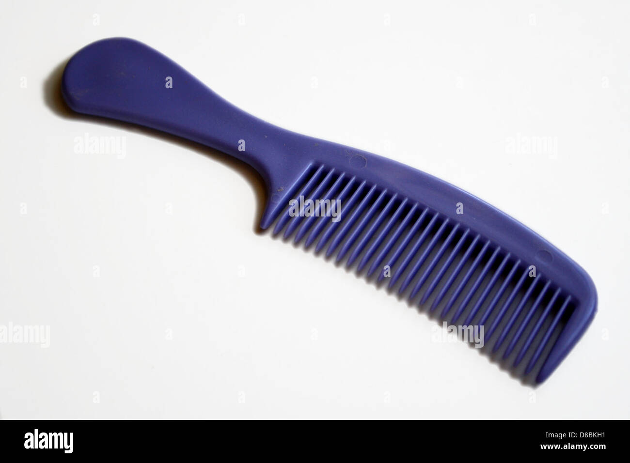 purple plastic comb with handle Stock Photo Alamy