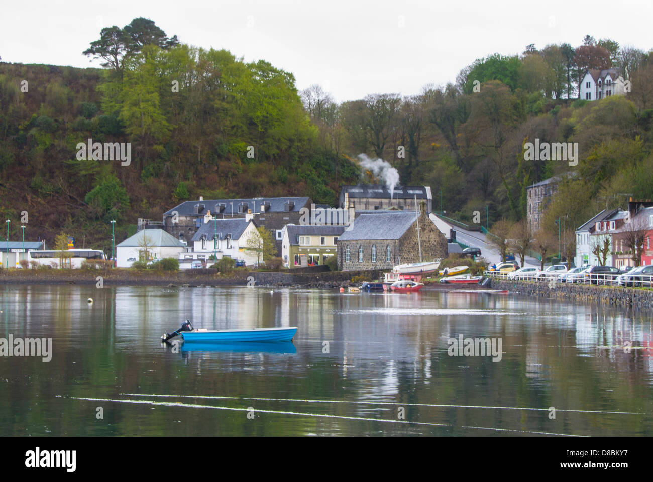 Tobermory harbour at high tide showing the whiskey distillery Stock Photo