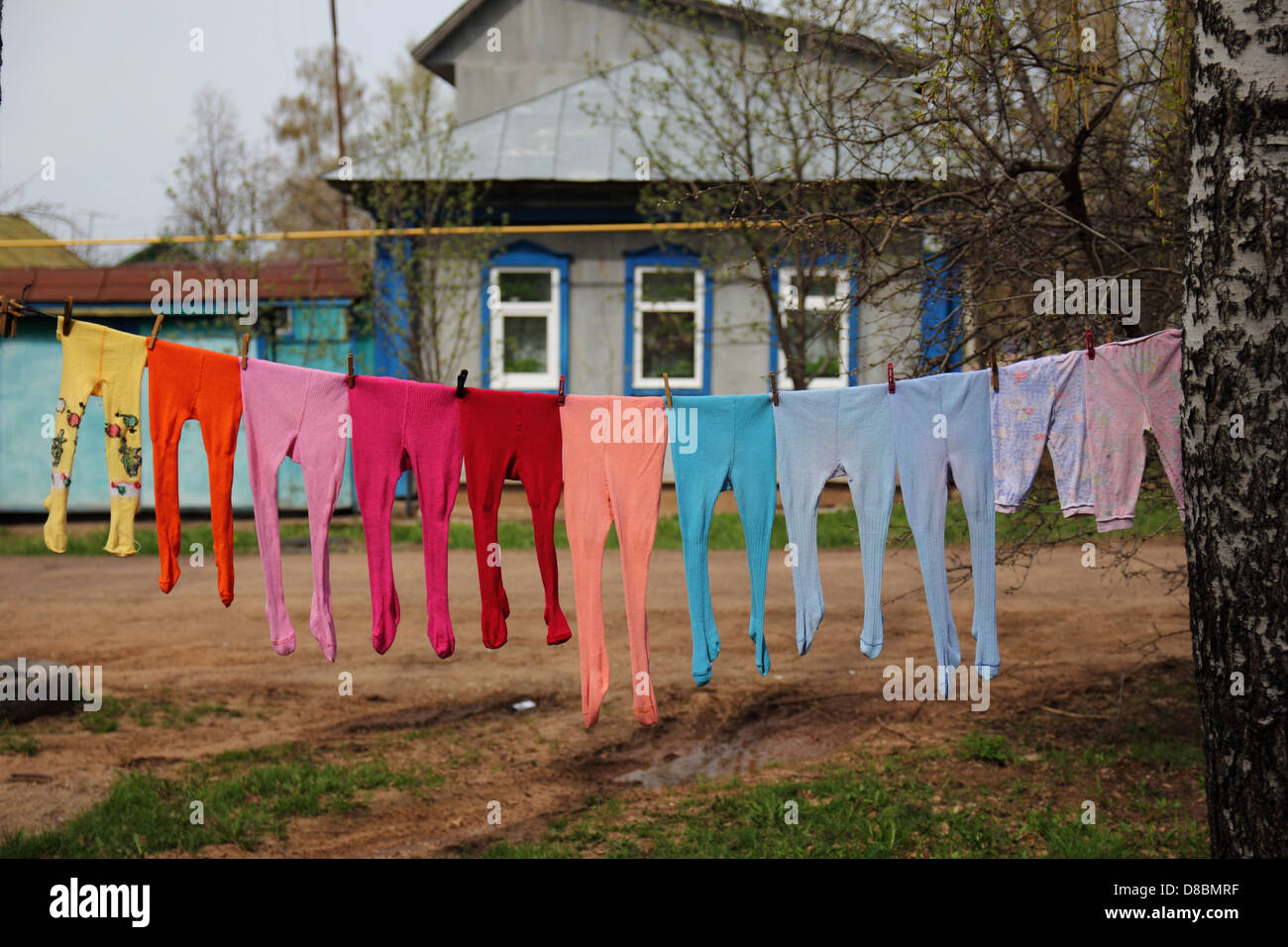 colorful children's stockings hanging on a rope Stock Photo