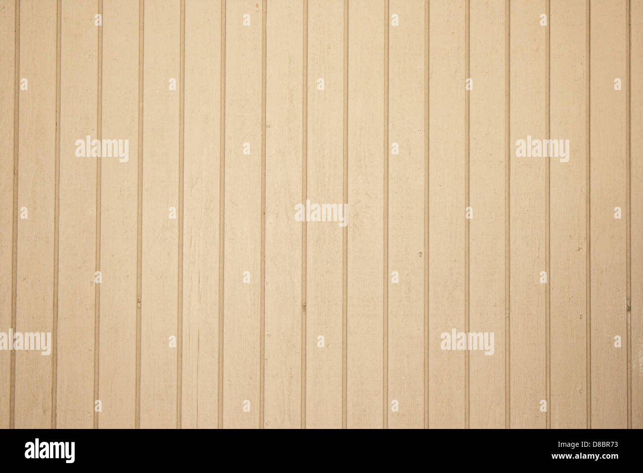 A close-up of tan-colored vertical siding, showing its smooth texture ...