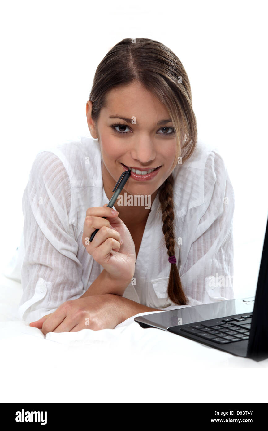 Woman using a laptop computer Stock Photo