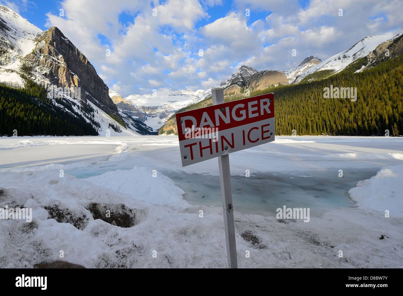 Danger thin ice sign warning at Lake Louise, Alberta, Canada Stock Photo