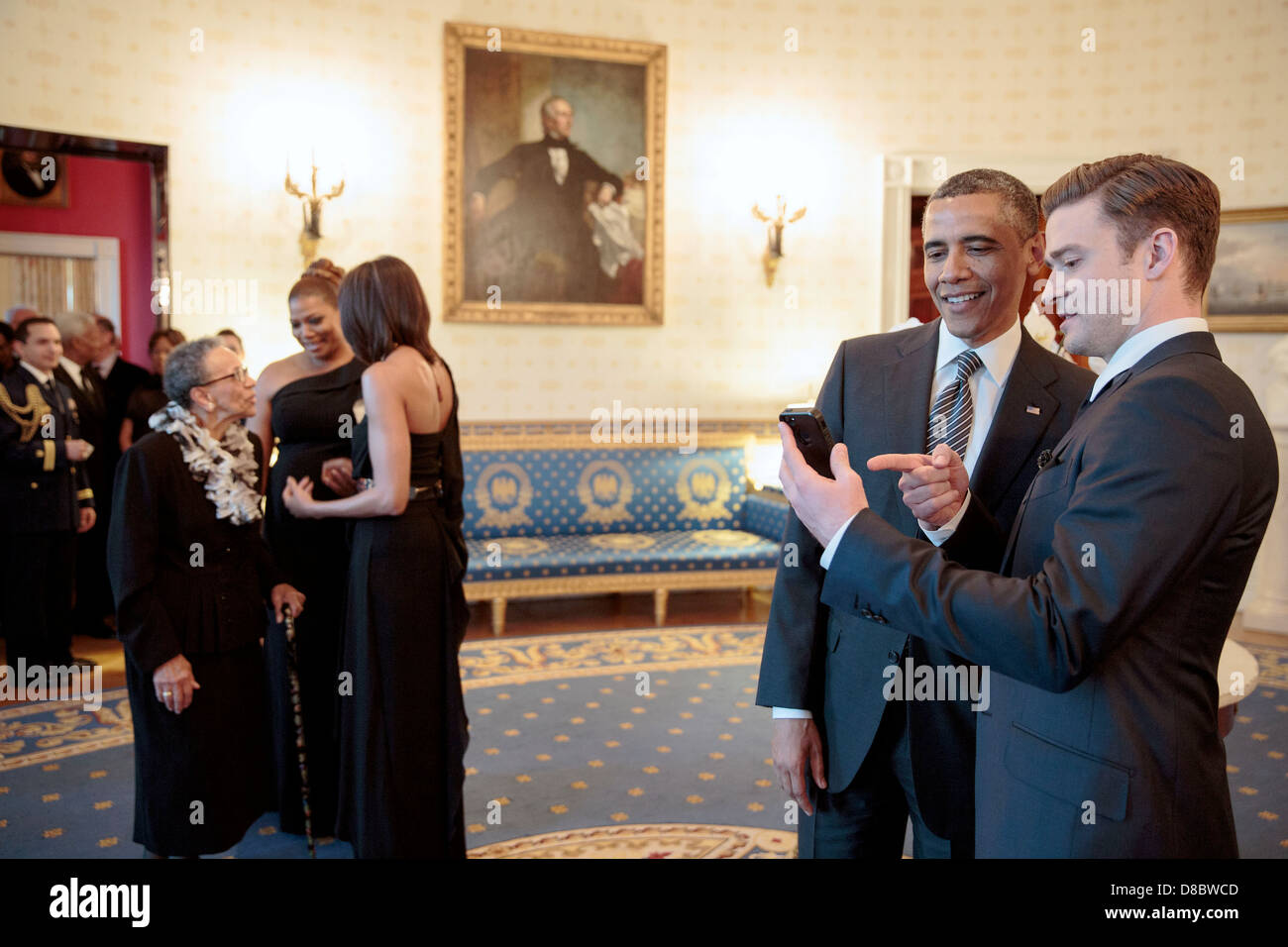 US President Barack Obama talks with performer Justin Timberlake in the Blue Room prior to the “In Performance at the White House: Memphis Soul” concert in the East Room of the White House, April 9, 2013 in Washington, DC. Stock Photo