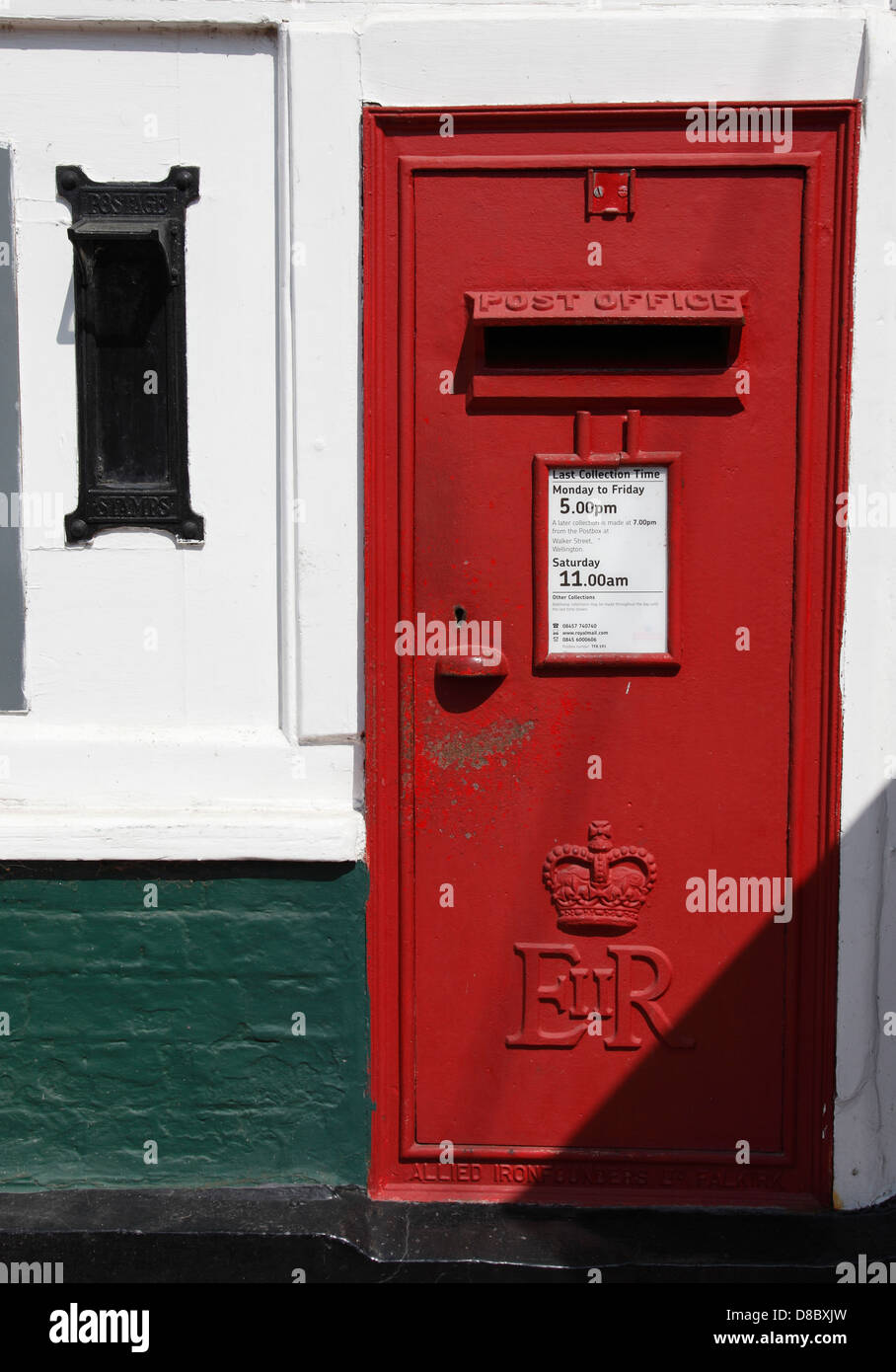 In wall postbox with stamp dispensing machine Ironbridge Ironbridge Gorge Shropshire Stock Photo