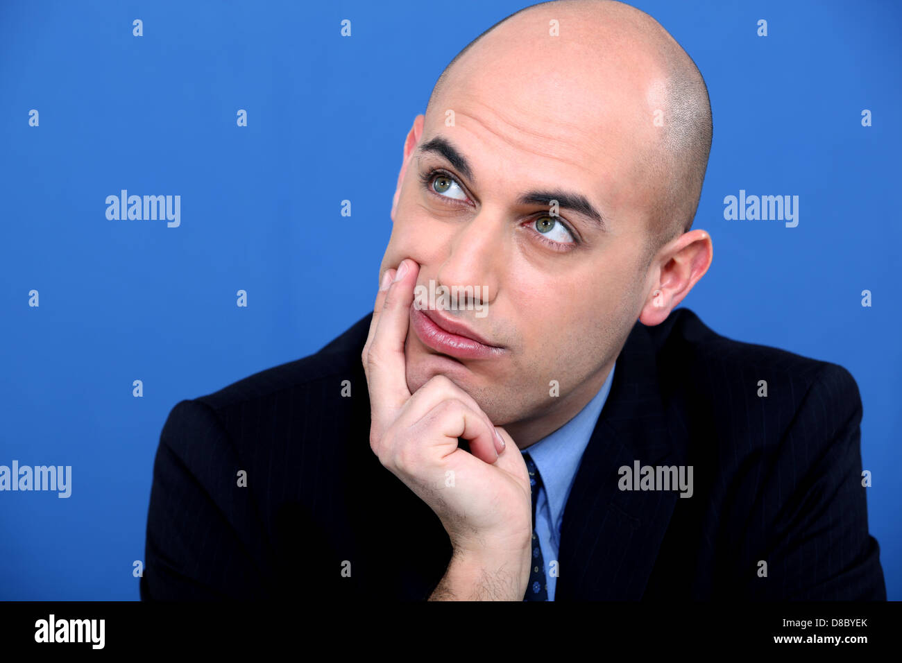 Pensive bald man Stock Photo