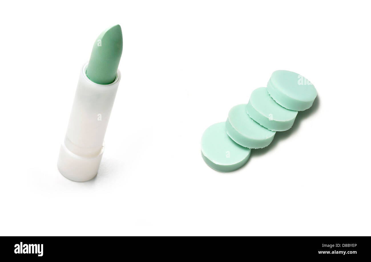 green concealer stick balm cut out onto a white background Stock Photo