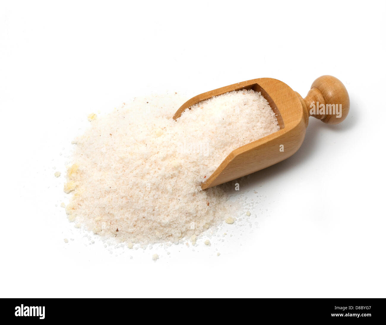 pile of bath/beauty salt with scoop cut out onto a white background
