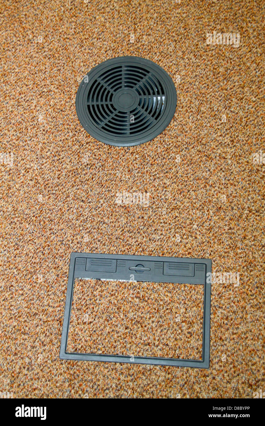 Raised office flooring data outlet box and vent Stock Photo