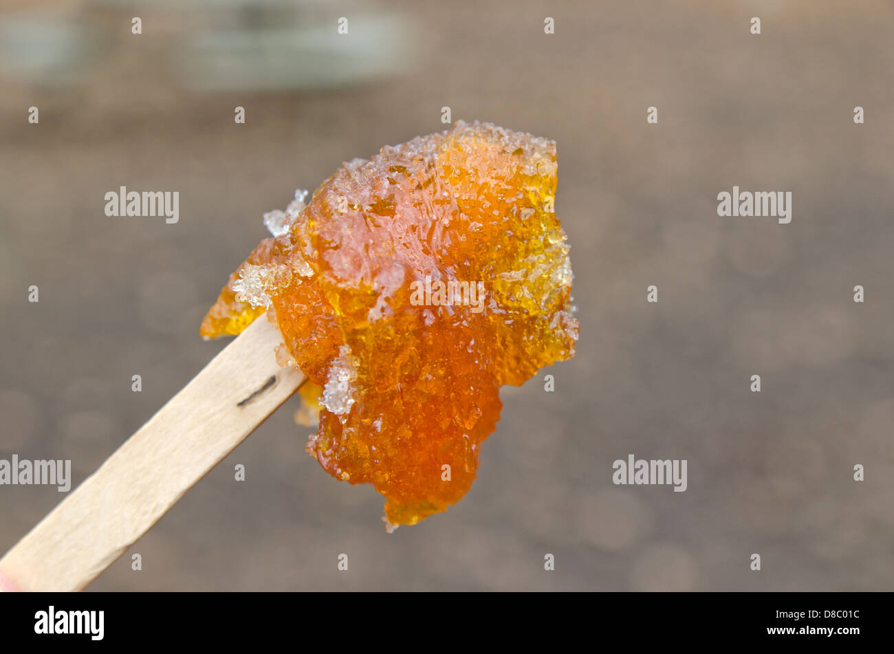 Maple taffy on a stick during sugar shack period Stock Photo Alamy