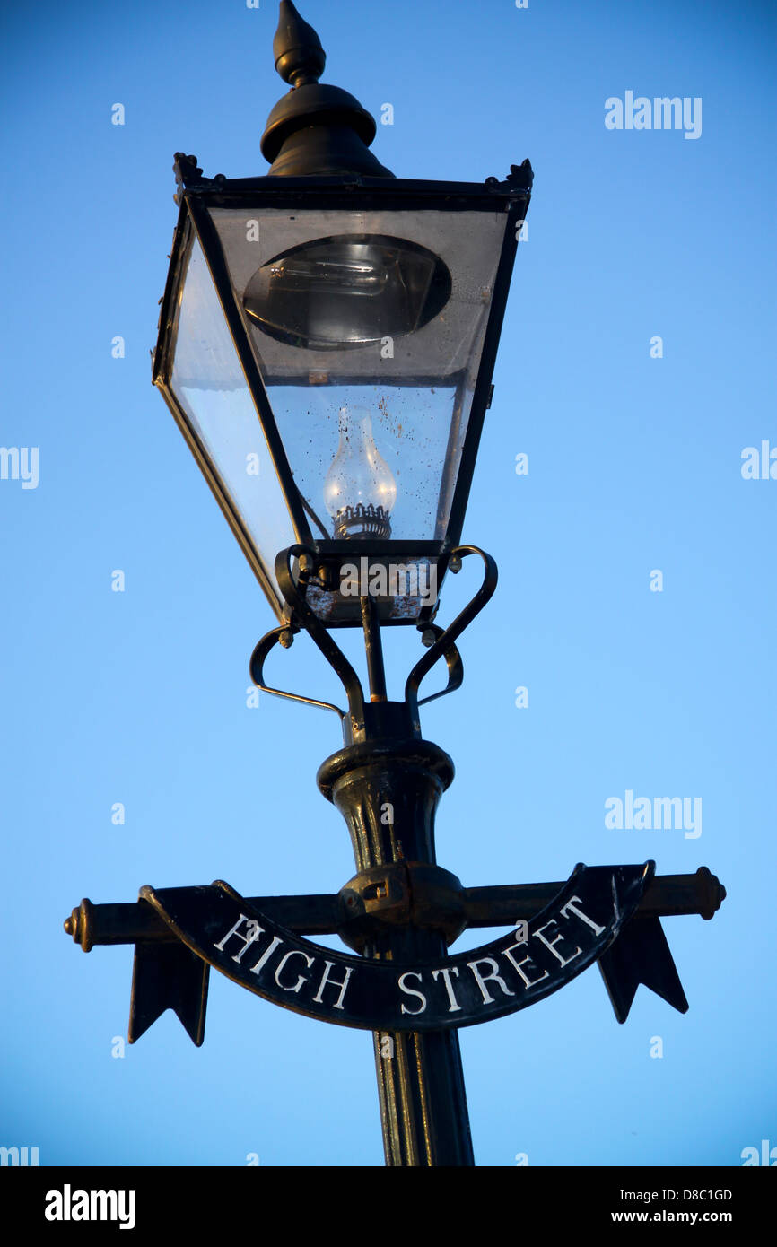 Cast iron street lamp with High Street sign Stock Photo - Alamy