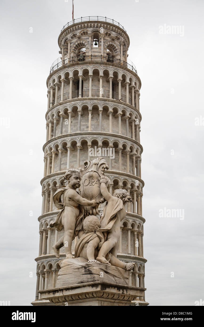 The Leaning Tower in Pisa, Italy with statue in foreground Stock Photo