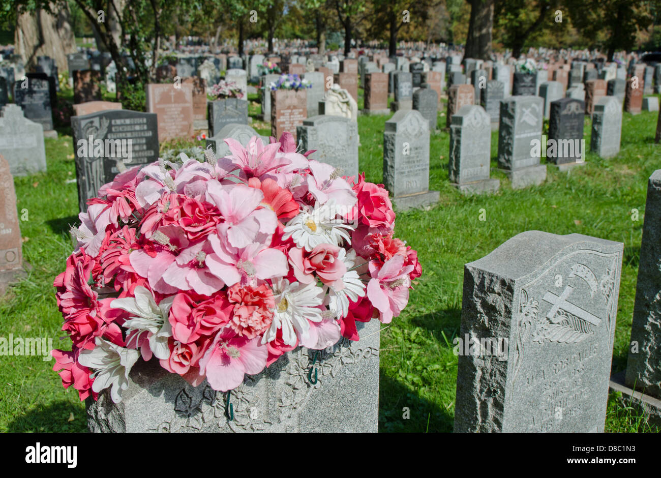 Gravestones and flowers in Montreal Cemetery Stock Photo