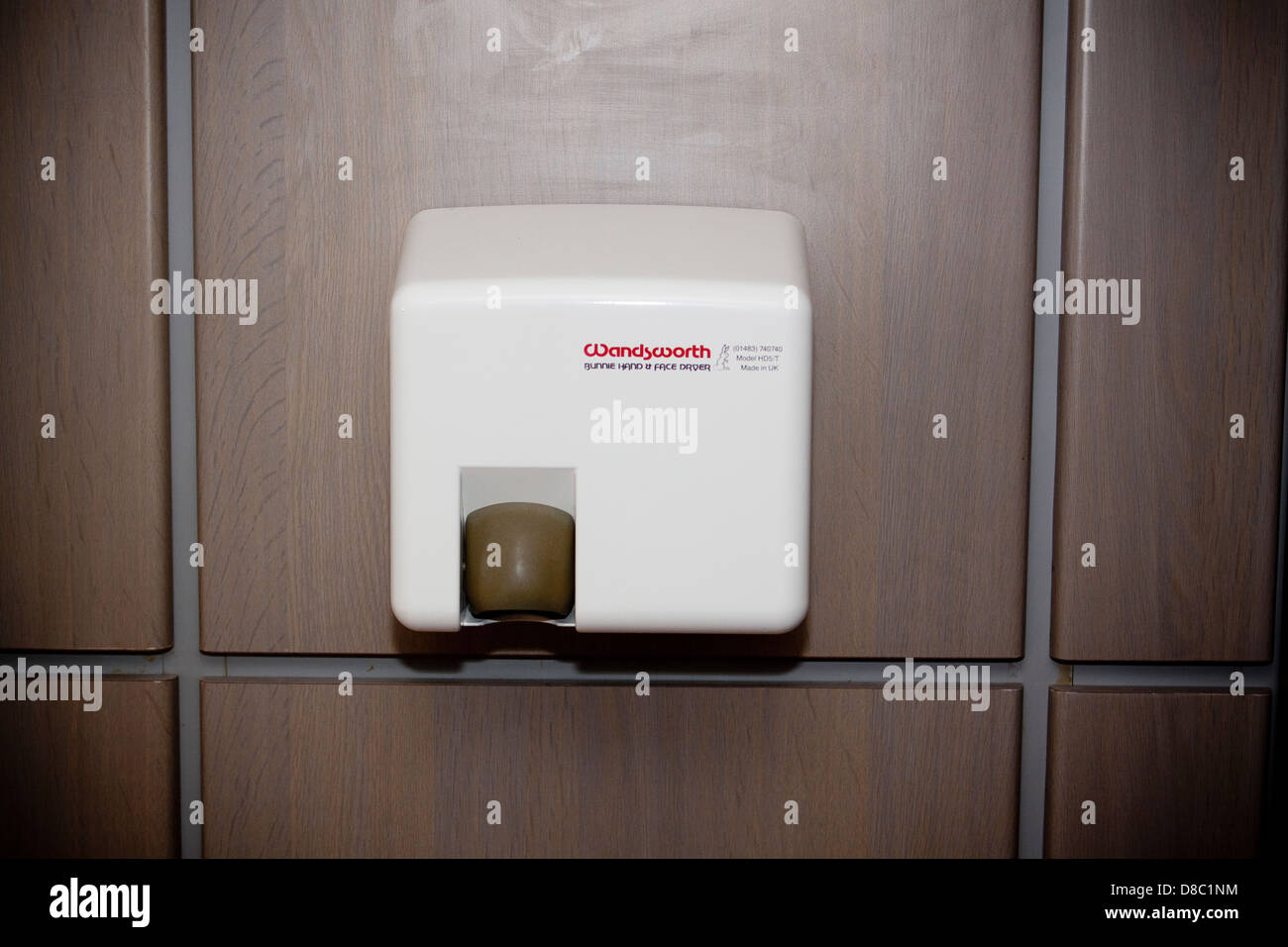 Wall mounted warm air hand dryer in toilet Stock Photo - Alamy