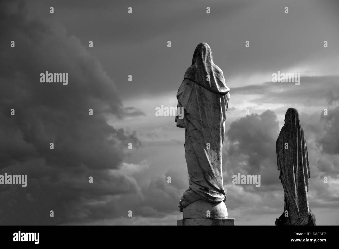 Statues in the graveyard of Turlough Round Tower, County Mayo, Ireland Stock Photo
