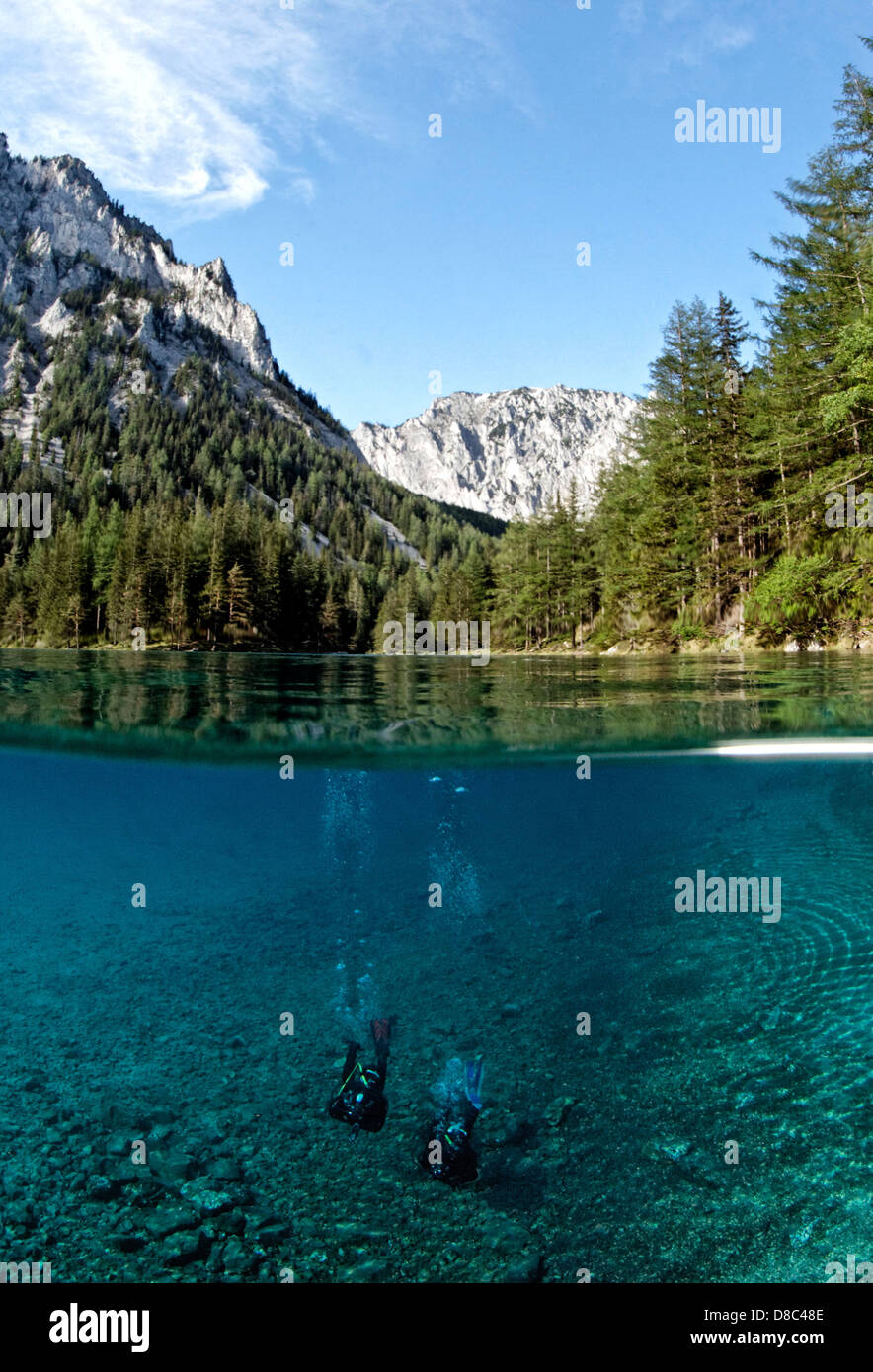 Two divers in Green lake, Tragoess, Styria, Austria, underwater shot Stock Photo