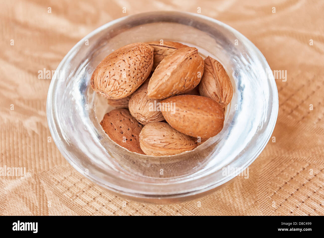Argan nuts in a small glass bowl. Stock Photo