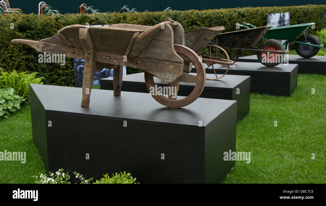 Four Wheelbarrows over 100 years at RHS Chelsea Flower Show 2013. This display formed part of the Centenary celebrations. Stock Photo