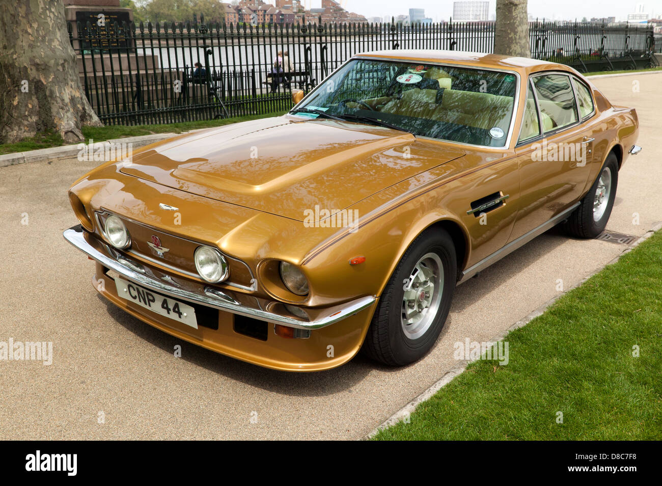 Three-quarter front view of a Gold, 1979 Aston Martin Vantage on display at  the Old Royal Naval College, Greenwich Stock Photo - Alamy