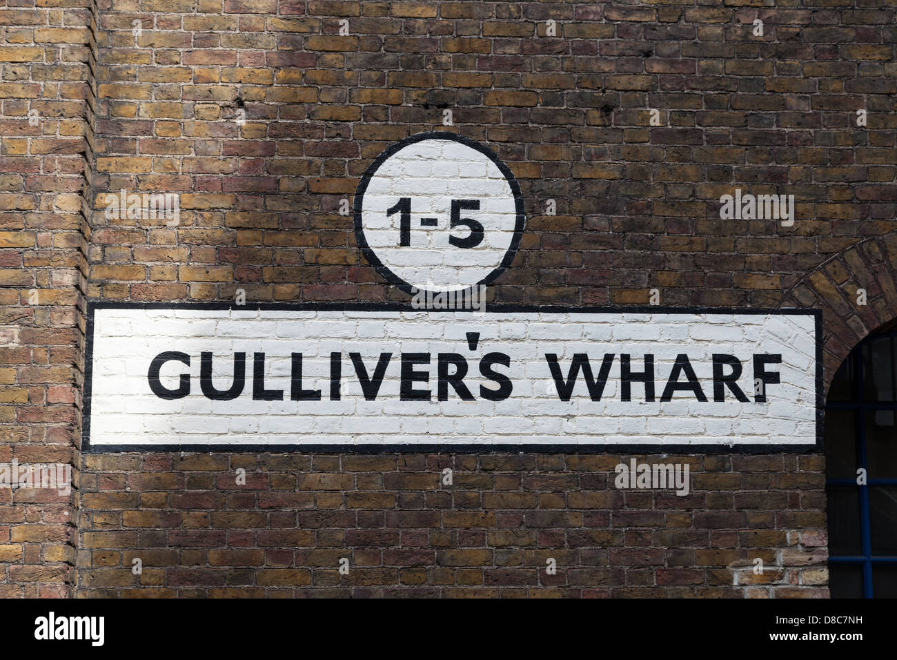 Old street signs on brick wall in Wapping, east London. Stock Photo